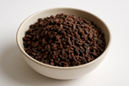 cacao nibs, raw, white background, in a bowl